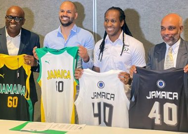 JaBA President Paulton Gordon, technical director of Stella Azzurra Basketball Academy and Jamaica minister of state for sport Alando Terrelonge peruse the document at the MOU signing at Jamaica Pegasus hotel in New Kingston on Thursday., January 12, 2023