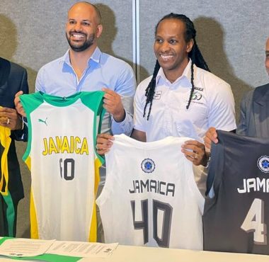 JaBA President Paulton Gordon, technical director of Stella Azzurra Basketball Academy and Jamaica minister of state for sport Alando Terrelonge peruse the document at the MOU signing at Jamaica Pegasus hotel in New Kingston on Thursday., January 12, 2023