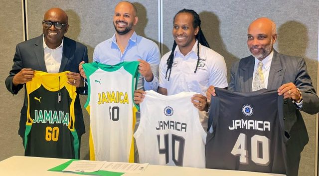 JaBA President Paulton Gordon, technical director of Stella Azzurra Basketball Academy and Jamaica minister of state for sport Alando Terrelonge peruse the document at the MOU signing at Jamaica Pegasus hotel in New Kingston on Thursday., January 12, 2023