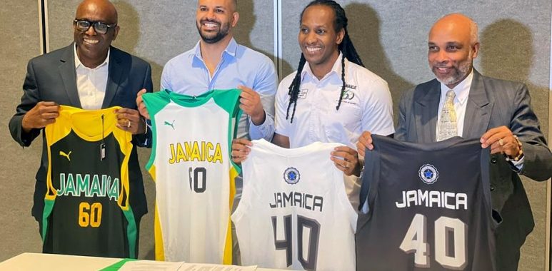 JaBA President Paulton Gordon, technical director of Stella Azzurra Basketball Academy and Jamaica minister of state for sport Alando Terrelonge peruse the document at the MOU signing at Jamaica Pegasus hotel in New Kingston on Thursday., January 12, 2023