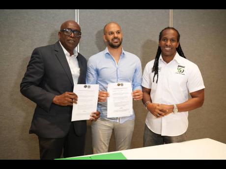 Paulton Gordon (left) President, Jamaica Basketball Association, Avshalom Filler Technical Director, Stella Azzurra Basketball Academy and Alando Terrelonge (right), State Minister in the Ministry of Culture, Gender, Entertainment and Sport, at the signing of a partnership agreement between the Jamaica Basketball Association and Italy-based Stella Azzurra Basketball Academy. The signing took place at the Jamaica Pegasus hotel on January 6, 2023