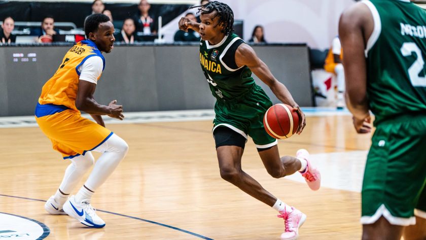 Romaine Thomas drives Barbados player