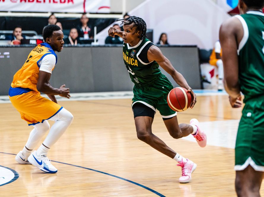 Romaine Thomas drives Barbados player