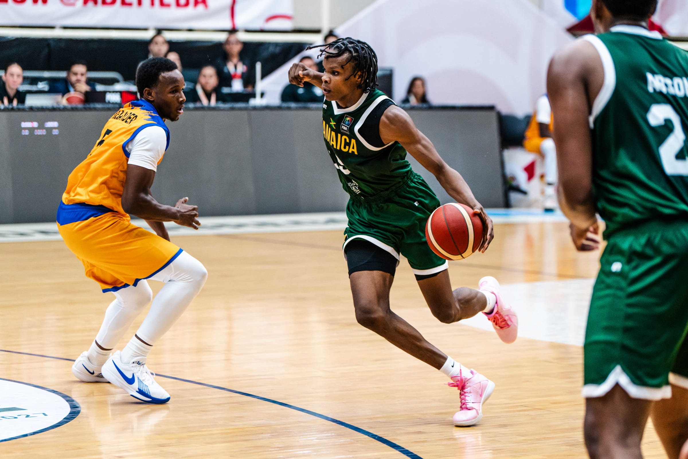 Romaine Thomas drives Barbados player